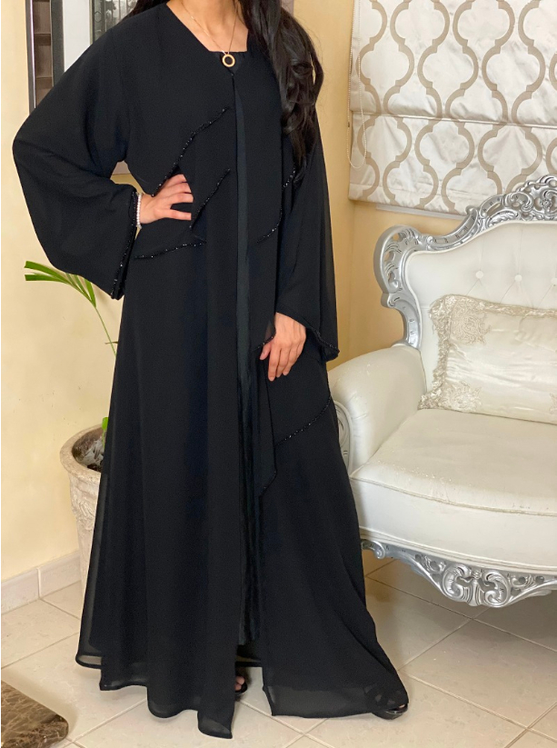 D00339 Abaya Black abaya featuring a layered chiffon fabric with tiered ...