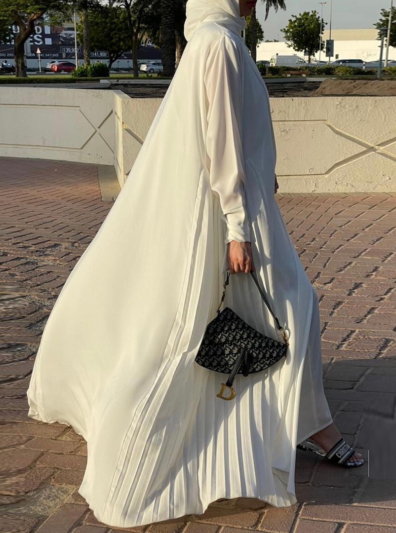 White Abaya Set An All-white set featuring an abaya with pleated side ...
